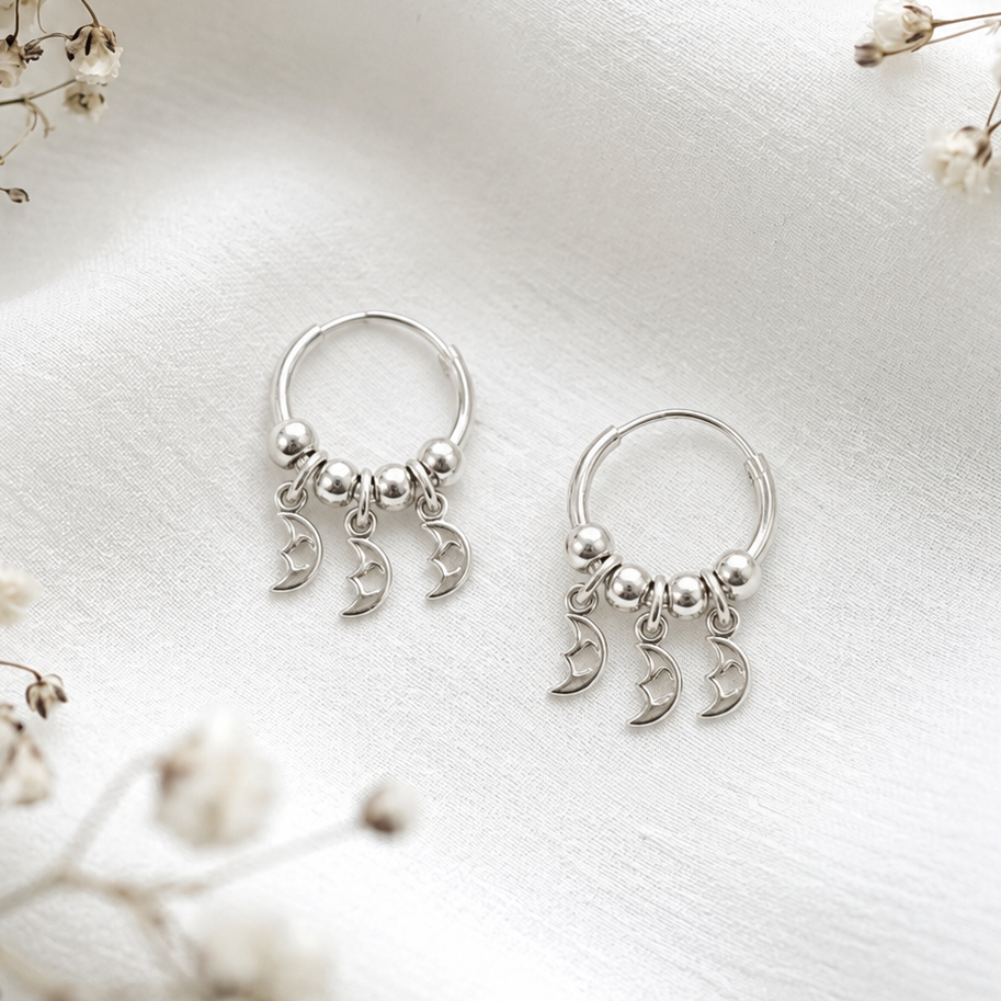 Aros argollas con lunas colgantes