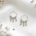 Aros argollas con lunas colgantes